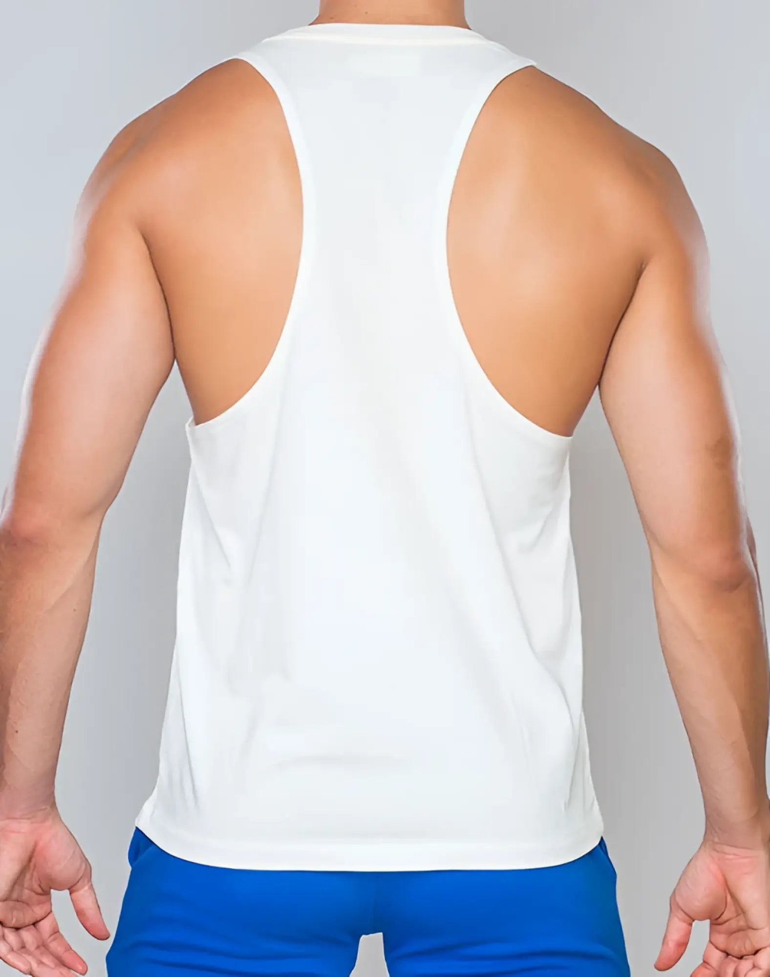 White SUPAWEAR racer back singlet with smooth lightweight fabric and minimalist design shown from the back side