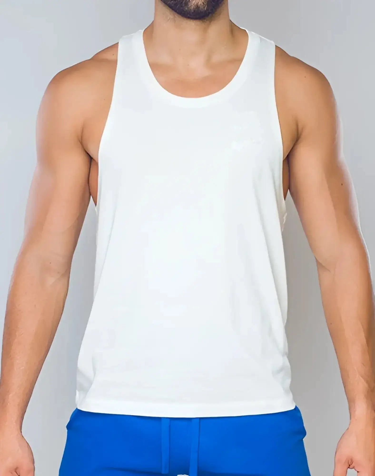 White sleeveless SUPAWEAR racer back singlet with subtle chest embroidery in grey white cotton blend fabric