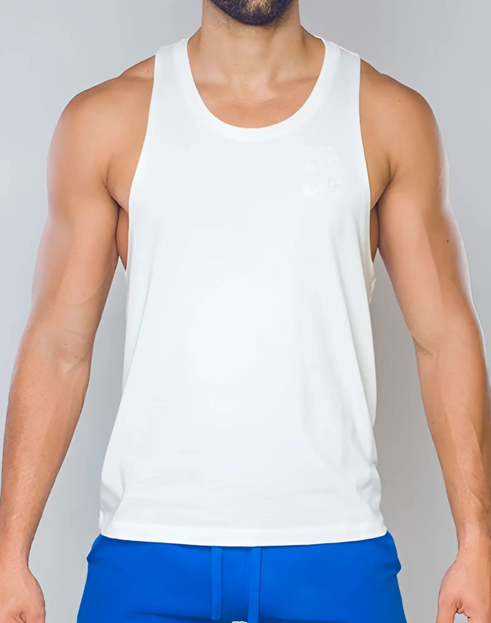 White sleeveless SUPAWEAR racer back singlet with subtle chest embroidery in grey white cotton blend fabric