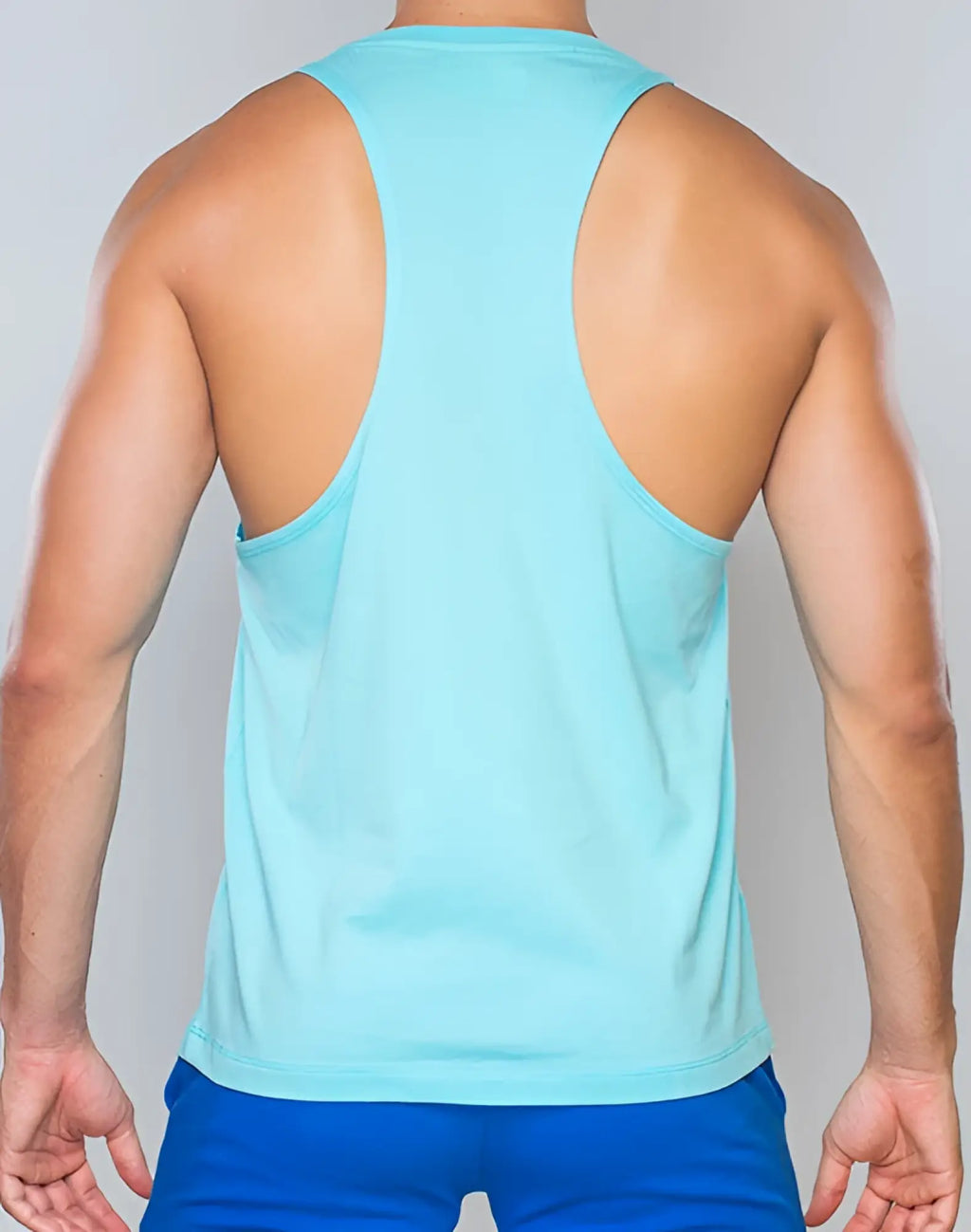 Light blue supawear racer back singlet made of smooth stretchy fabric shown from the back view