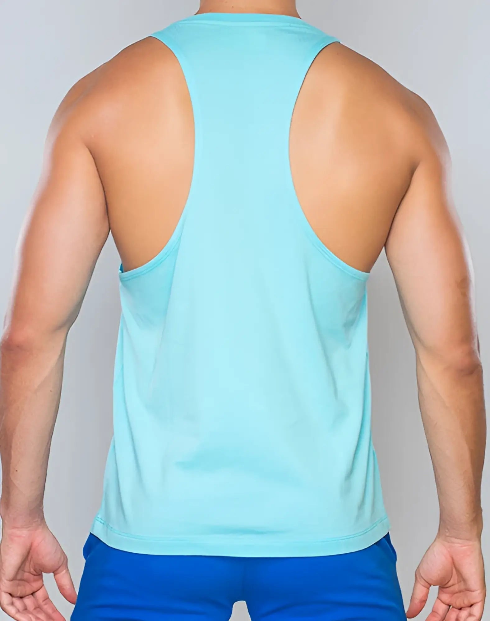 Light blue supawear racer back singlet made of smooth stretchy fabric shown from the back view