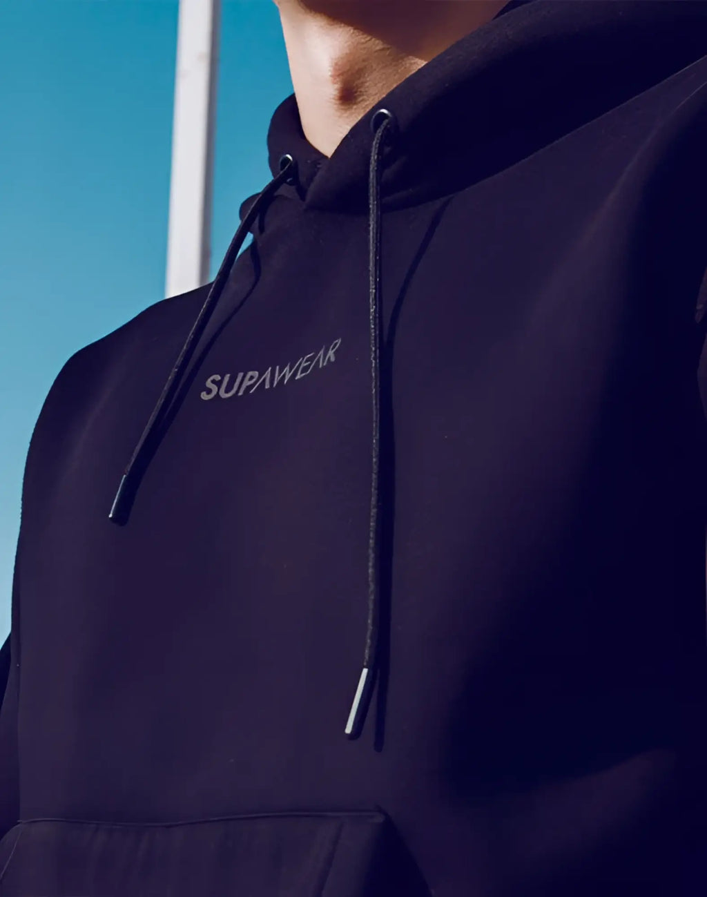 Black supawear recovery hoodie with matching drawstrings and subtle embroidered branding on soft fabric