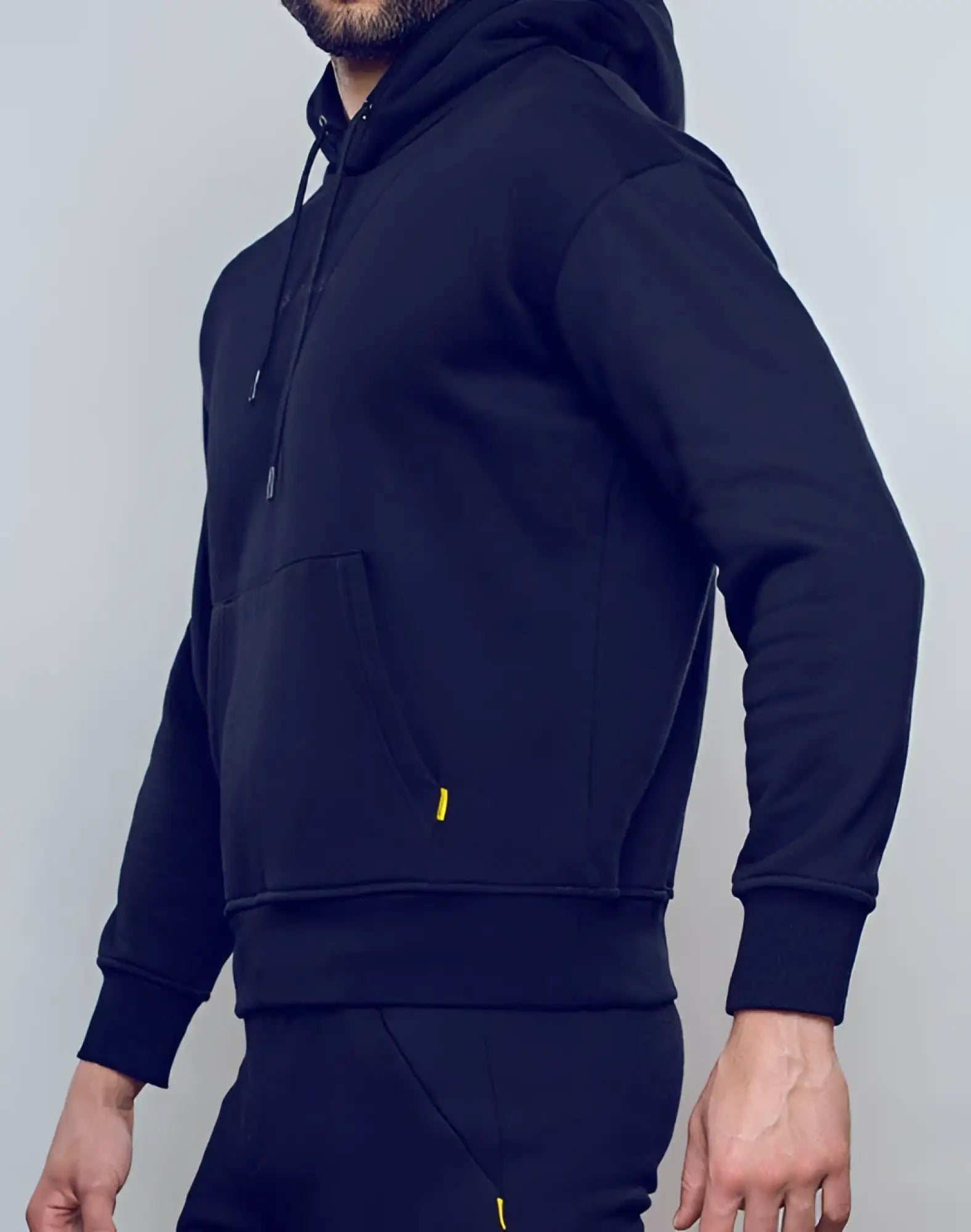 SupaWear recovery hoodie in black with subtle yellow zipper pulls on front pockets made from soft fabric