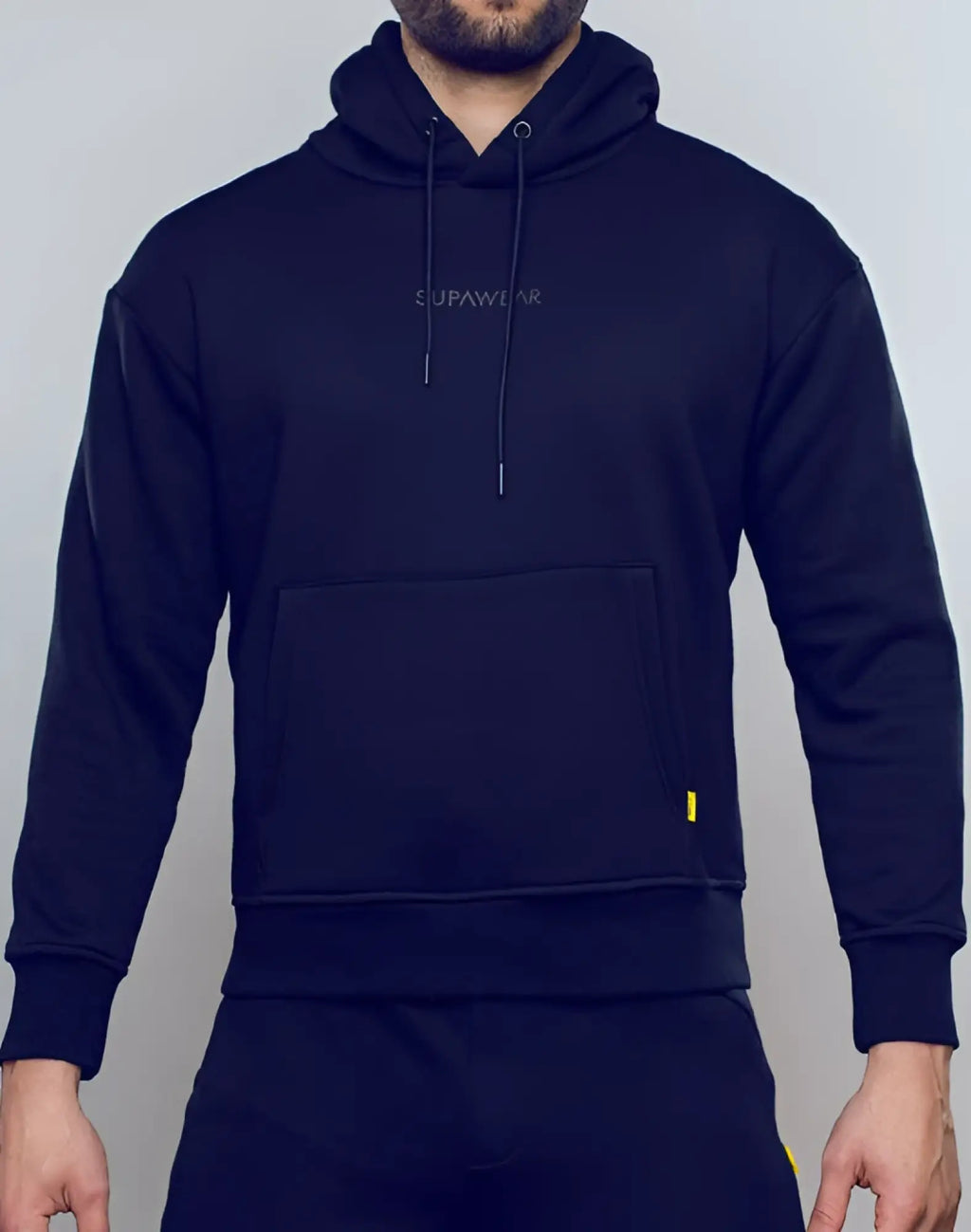 Black supawear recovery hoodie with subtle embroidered logo and yellow zipper pull for comfortable casual wear