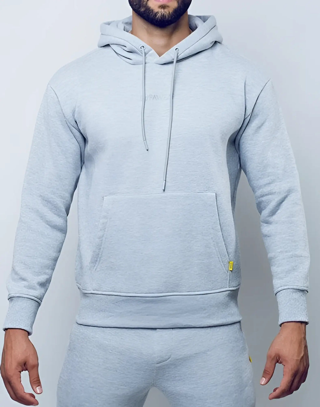 SupaWear recovery hoodie in grey marle with front pocket and subtle yellow branding on the sleeve