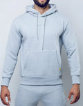 SupaWear recovery hoodie in grey marle with front pocket and subtle yellow branding on the sleeve