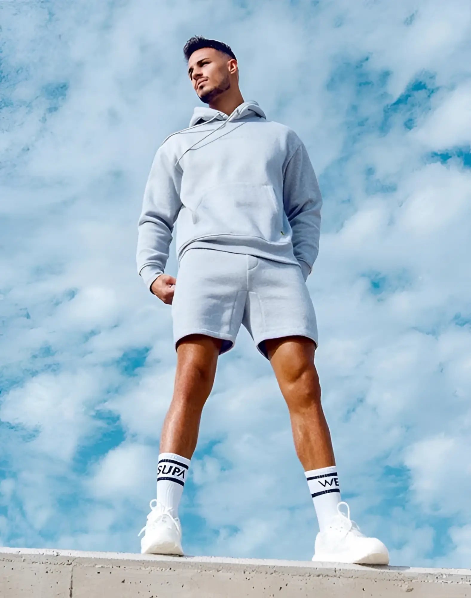 Light gray supra hoodie and matching shorts set made from soft grey marle fabric for recovery and comfort