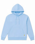 Light blue SUPAWEAR recovery hoodie with subtle gray embroidered logo and small yellow tag on lower right sleeve
