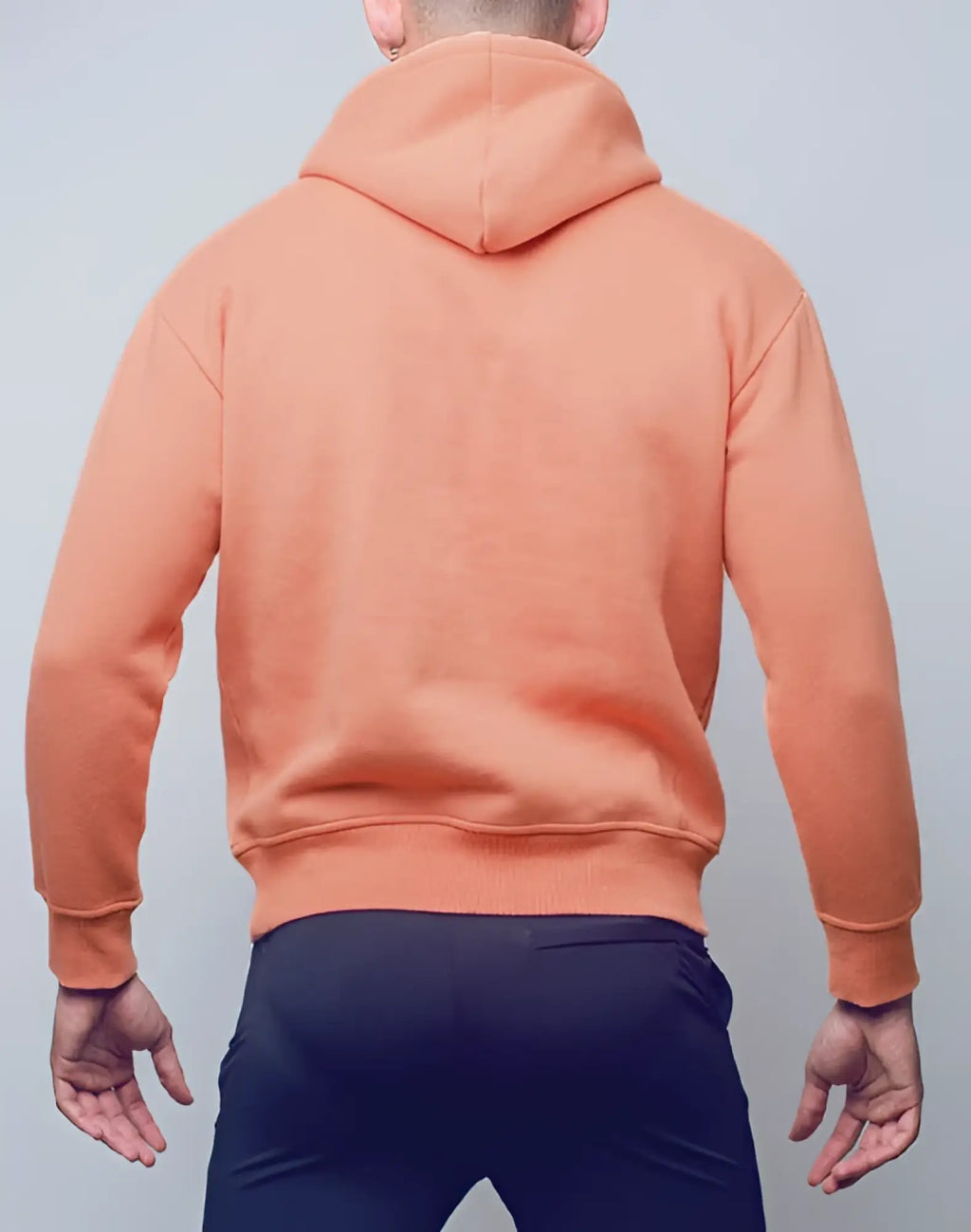 A soft peach-colored supawear recovery hoodie with hood ribbed cuffs and hem in reboot clay material