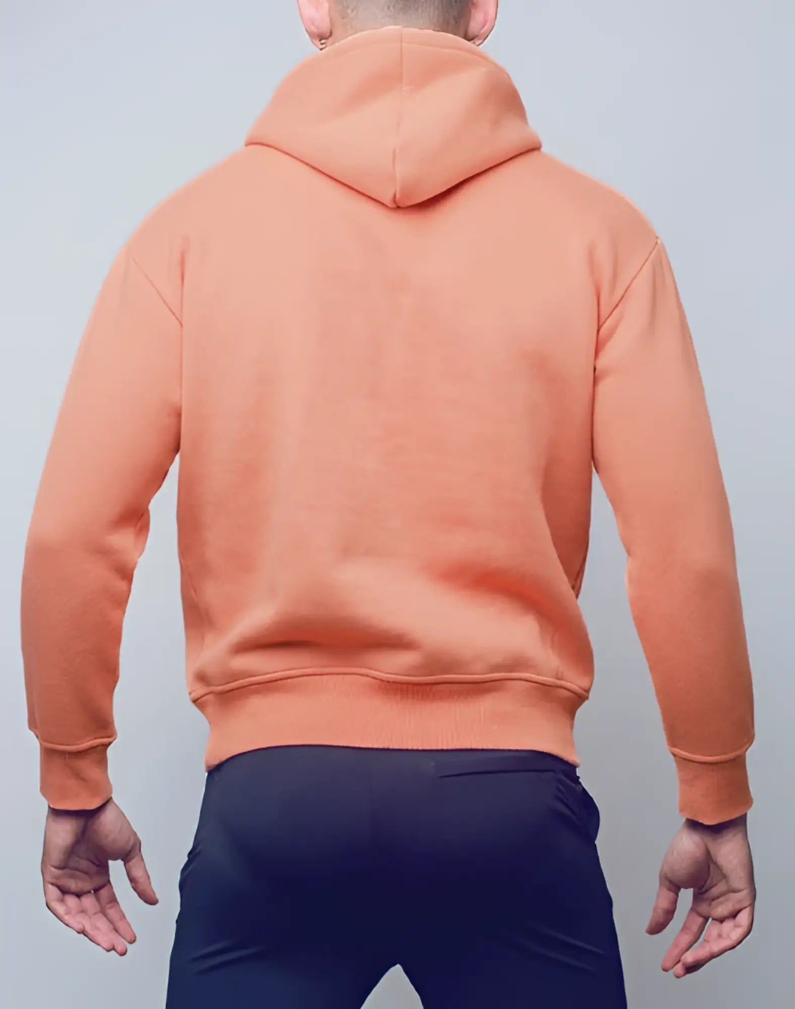 A soft peach-colored supawear recovery hoodie with hood ribbed cuffs and hem in reboot clay material
