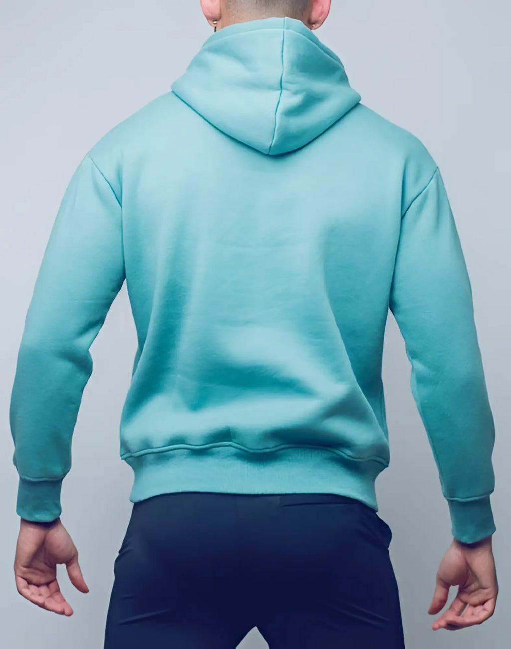 A soft teal supawear recovery hoodie with relaxed fit and ribbed cuffs designed for comfort and recovery