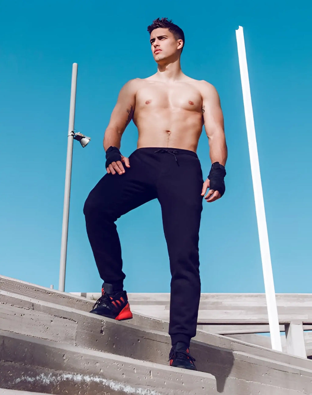 Black supawear recovery pants with drawstring waistband and tapered legs designed for athletic use