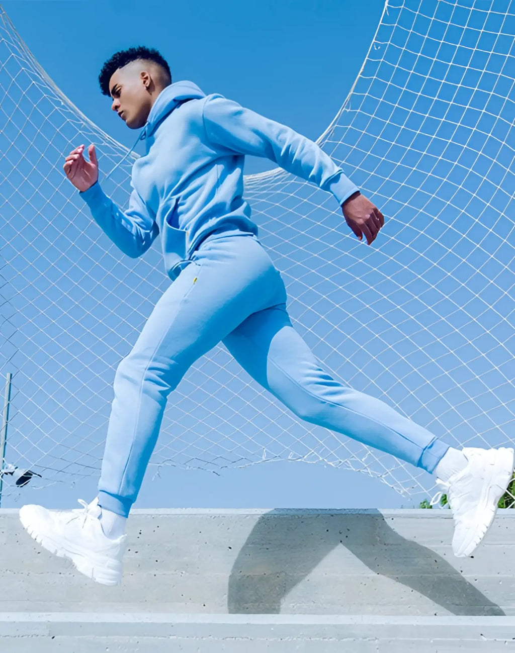 Light blue supawear recovery hoodie and matching joggers set designed for comfort and athletic recovery wear