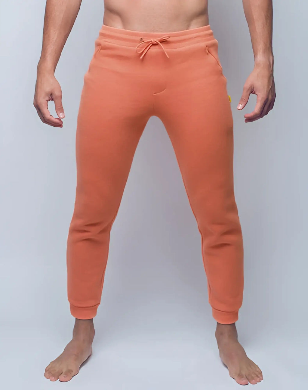 Orange SUPAWEAR Recovery pants with drawstring waistband and ribbed cuffs in soft Reboot Clay fabric