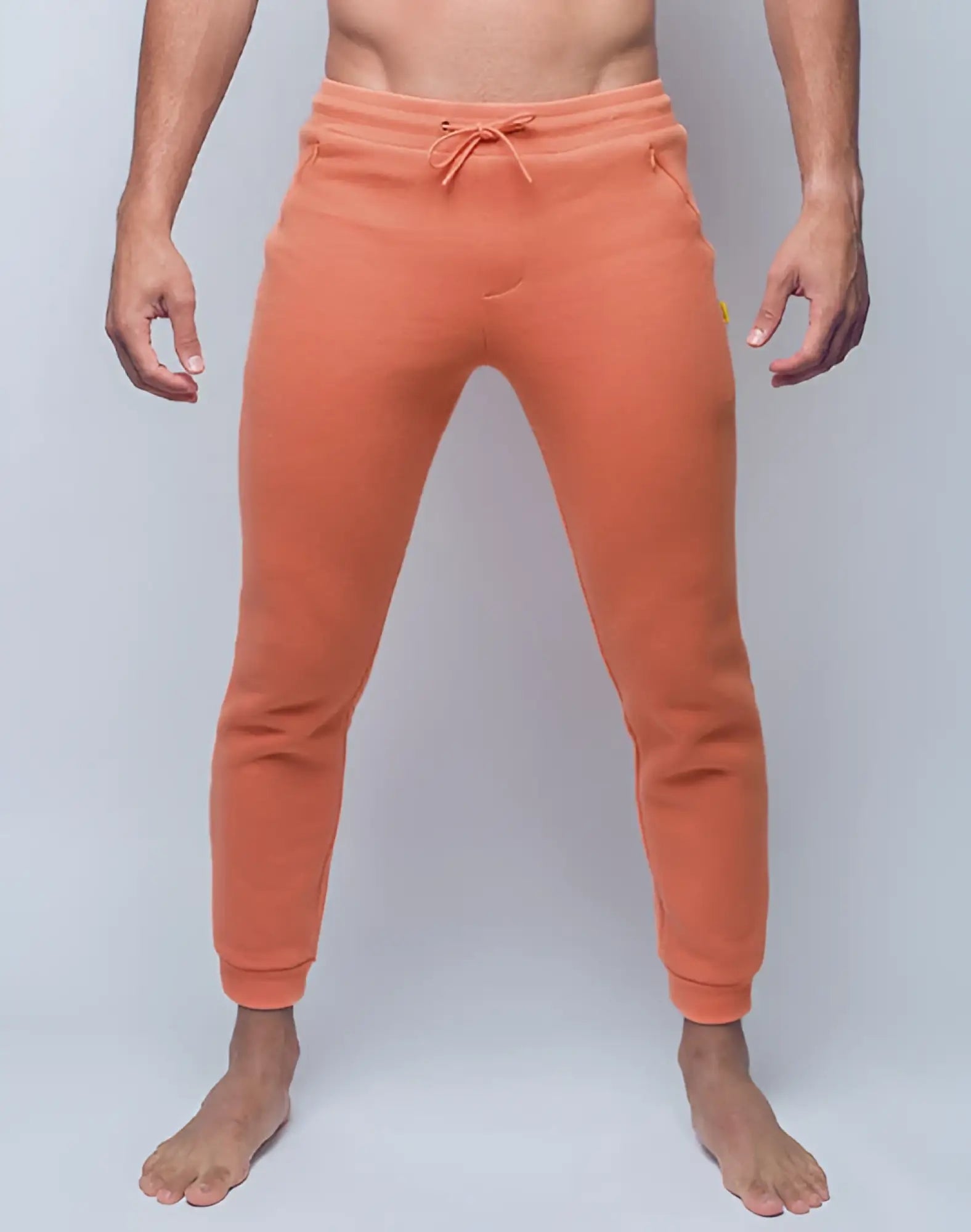 Orange SUPAWEAR Recovery pants with drawstring waistband and ribbed cuffs in soft Reboot Clay fabric