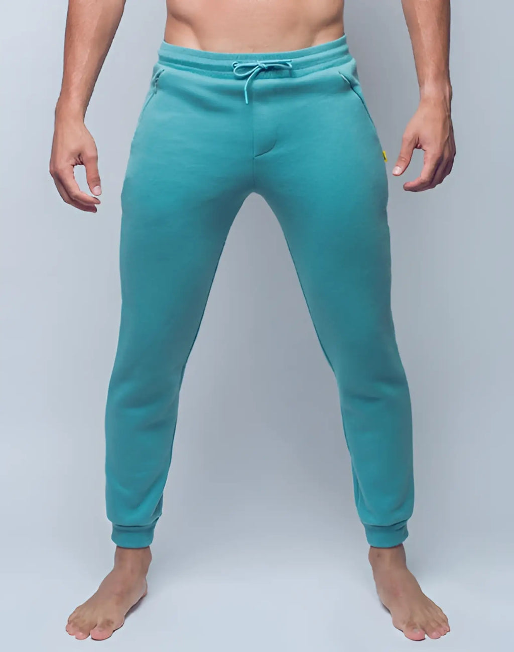 Supawea recovery pants in reboot green featuring teal jogger style with drawstring waistband and ribbed cuffs