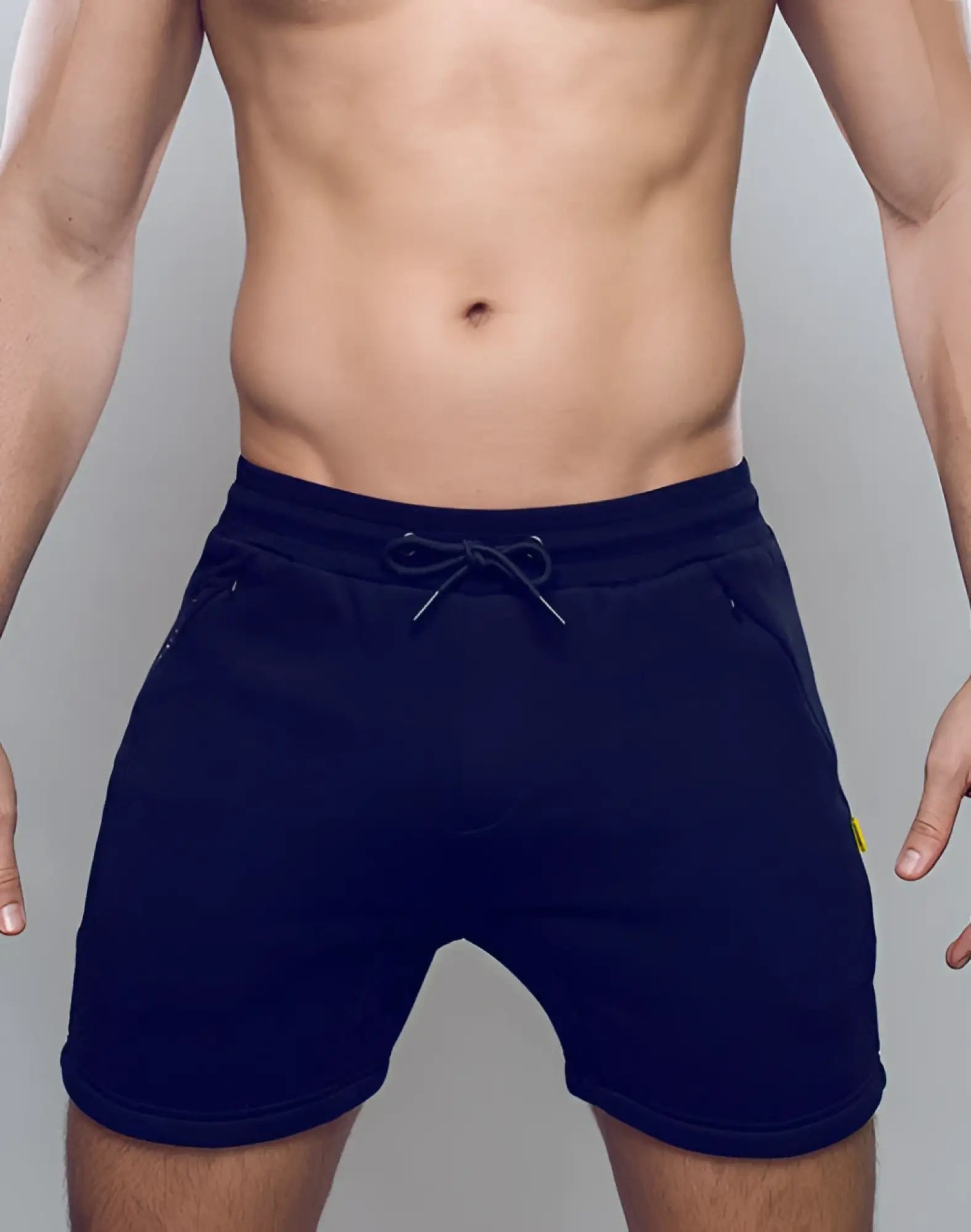 Navy blue SUPAWEAR recovery shorts with drawstring waistband and side pockets designed for athletic use