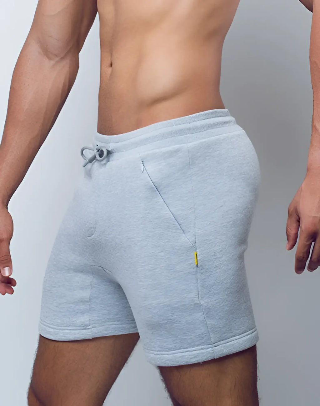 SupaWear recovery shorts in light gray heathered fabric with drawstring waistband side pockets and yellow accent