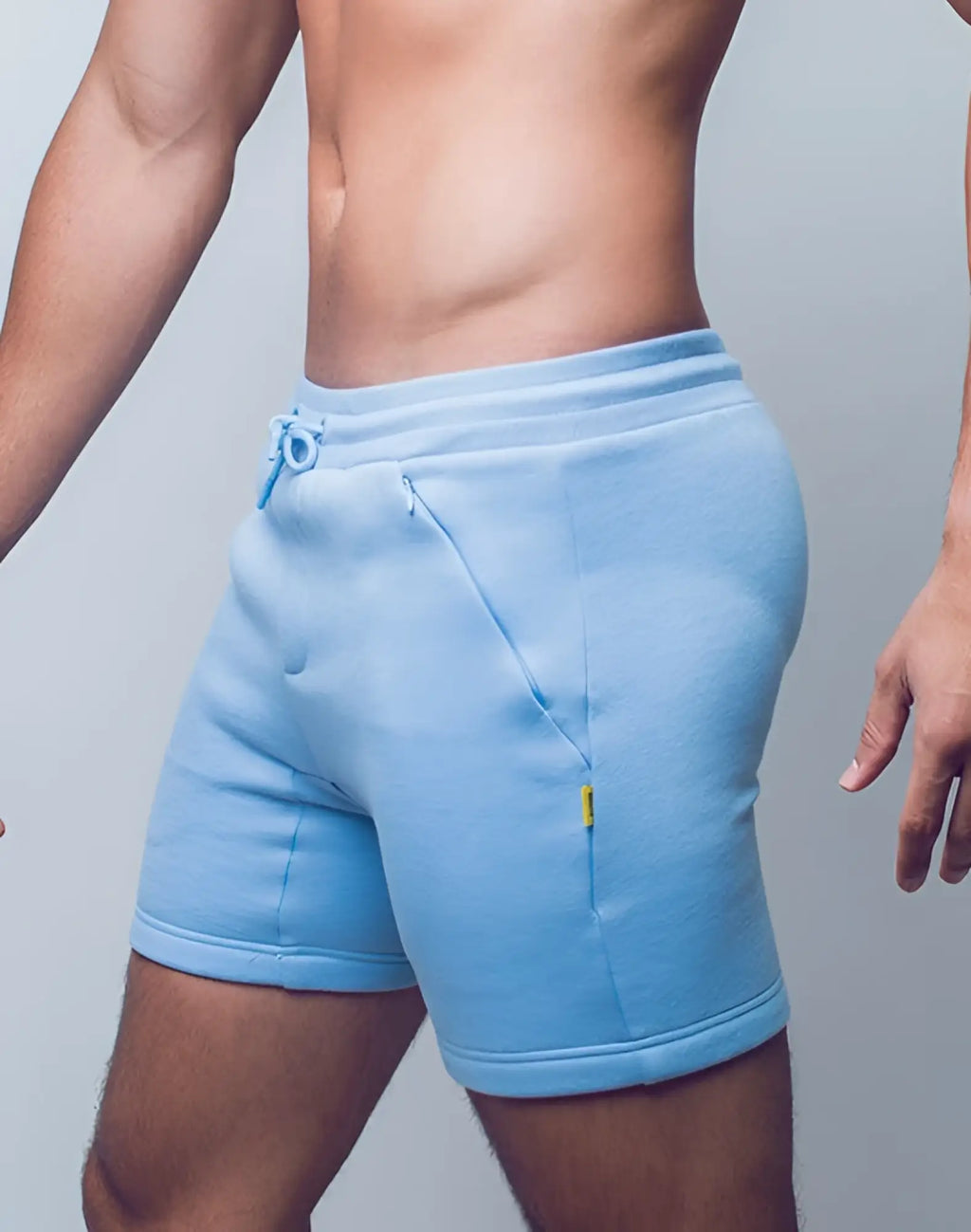 Light blue fleece supawear recovery shorts with drawstring waistband side pockets and yellow tag on right pocket