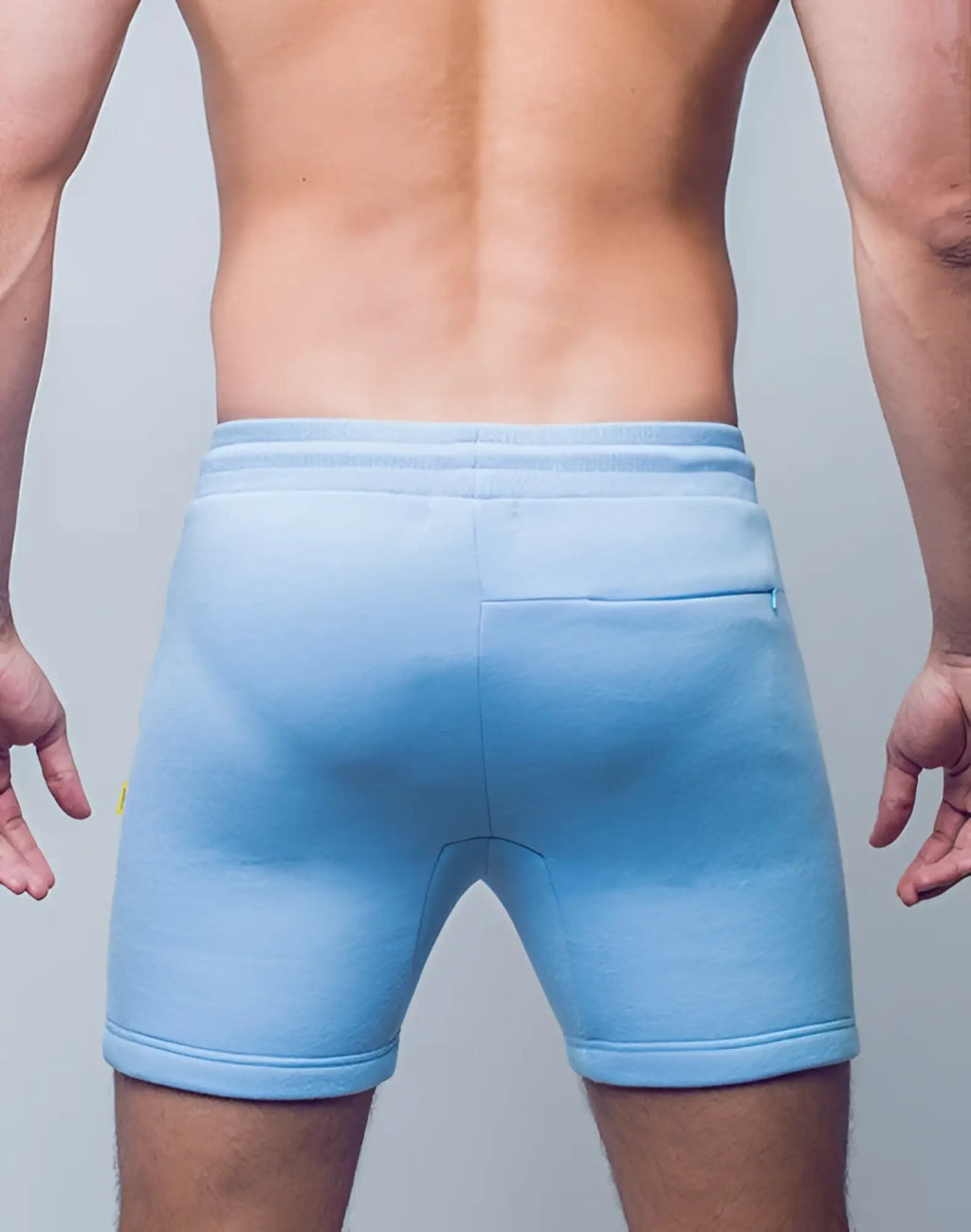 Back side of supawear recovery shorts in reboot blue with soft texture ribbed waistband and single rear pocket