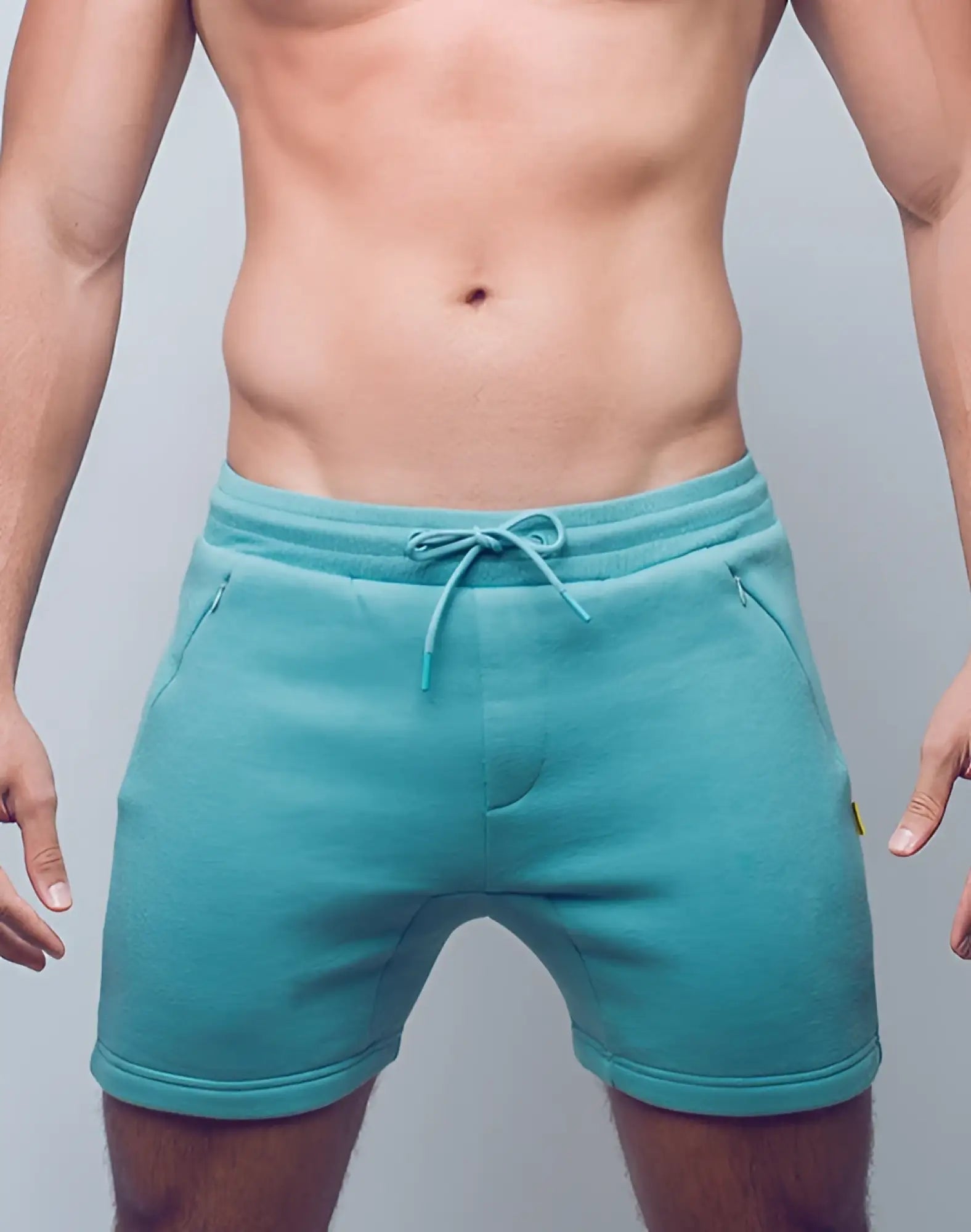 SupaWear recovery shorts in reboot green with teal soft fleece fabric drawstring waistband and subtle side pockets