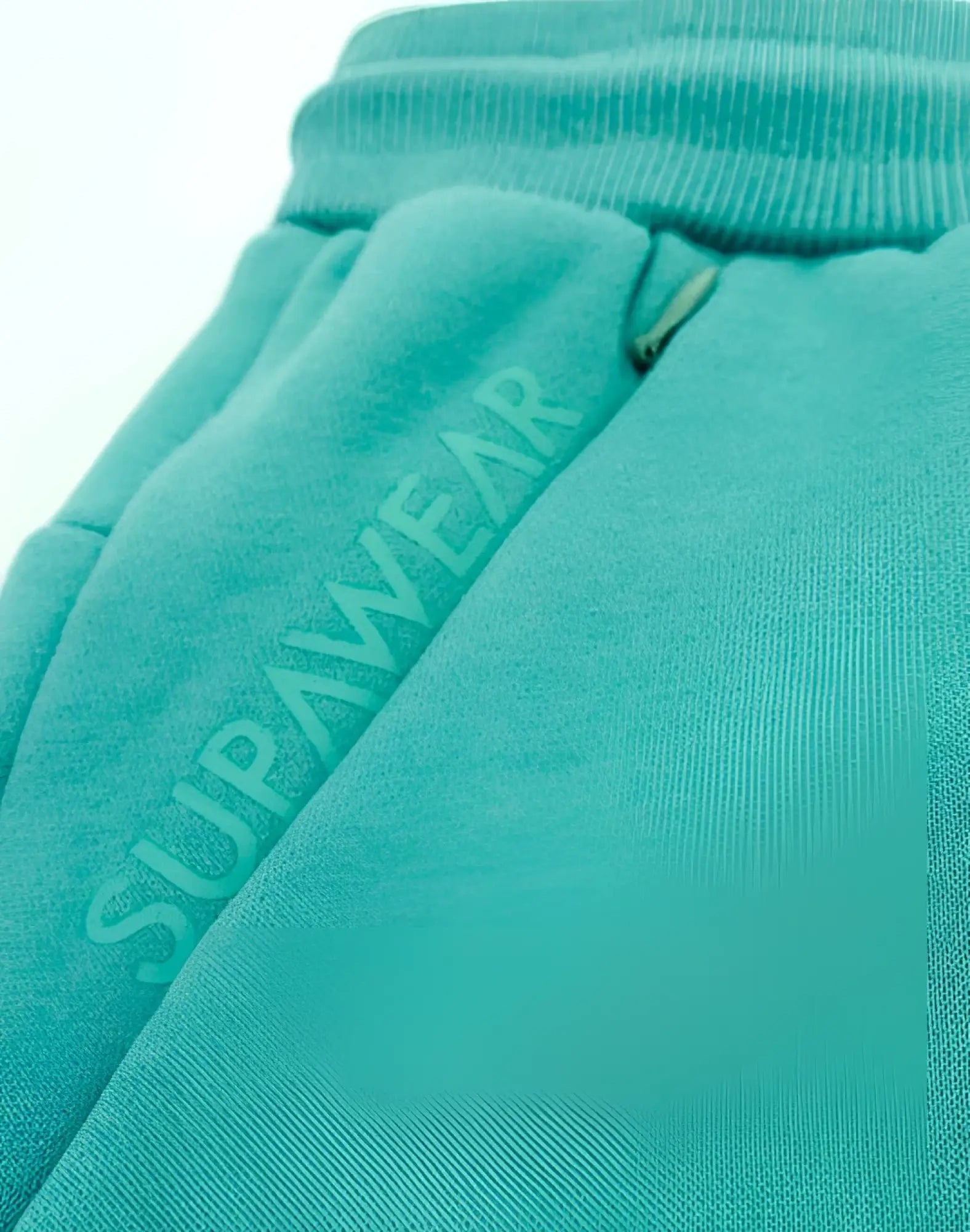 Turquoise supawear sweatpants with ribbed waistband and zipper detail for recovery in reboot green color