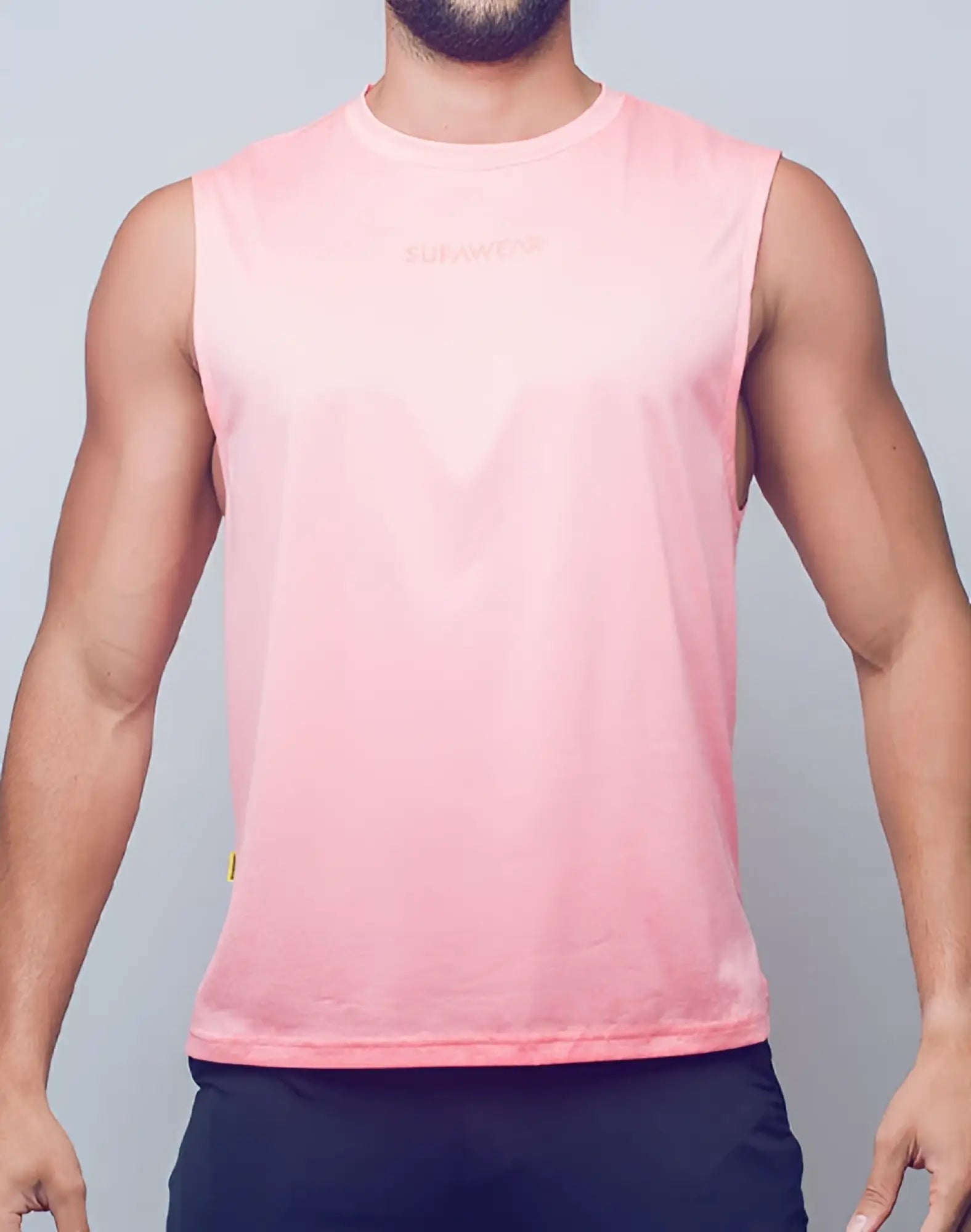 SupaWear recovery tank in soft pink with subtle gradient and embroidered sunwear logo for athletic wear