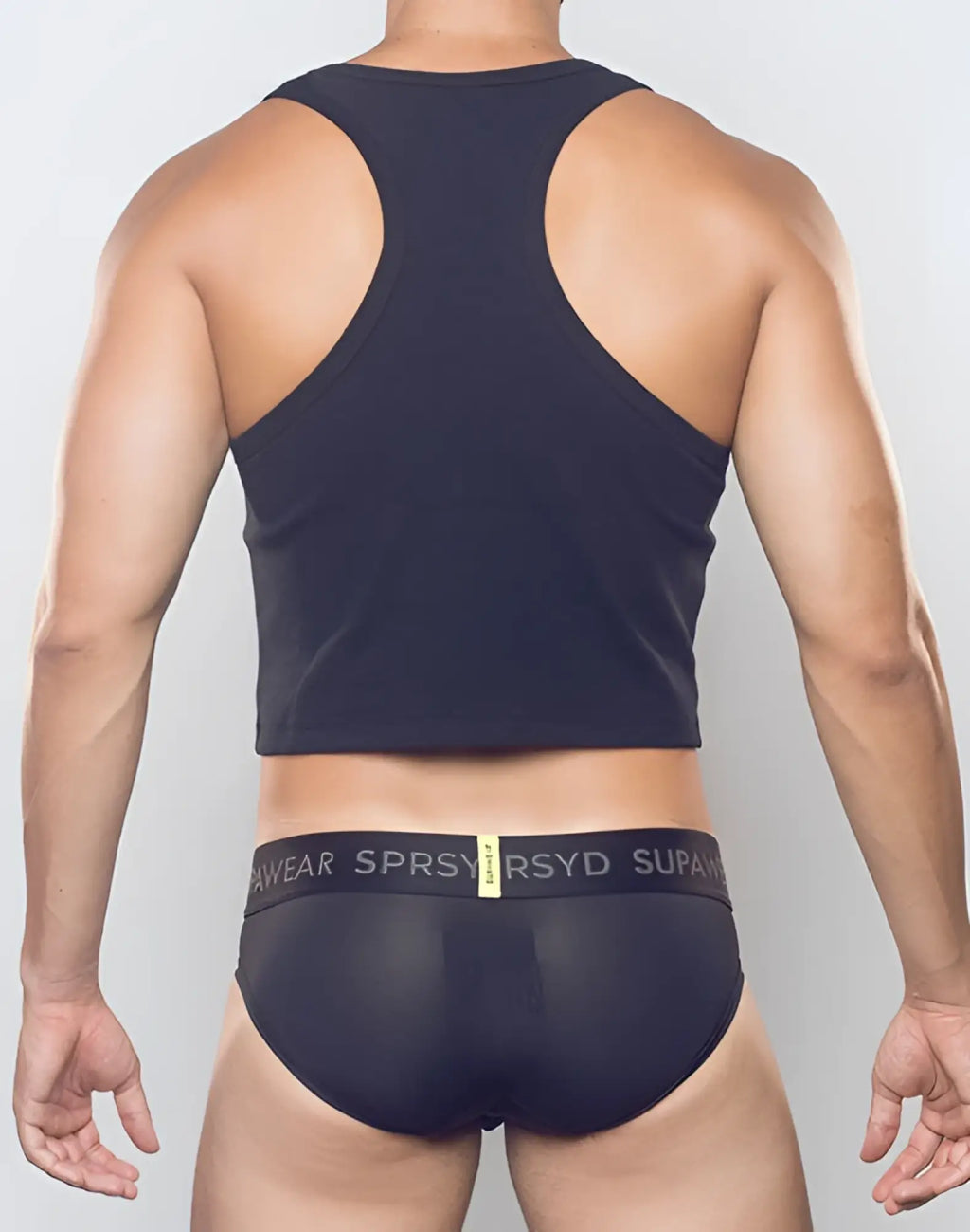 Black SUPAWEAR ribbed cropped singlet with racerback design and subtle texture shown from the back side