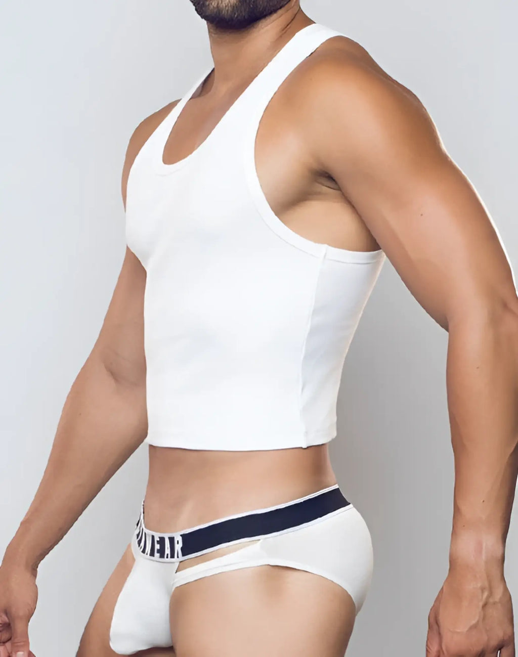 White ribbed SUPAWEAR cropped singlet with racerback design and subtle seam detailing for casual wear