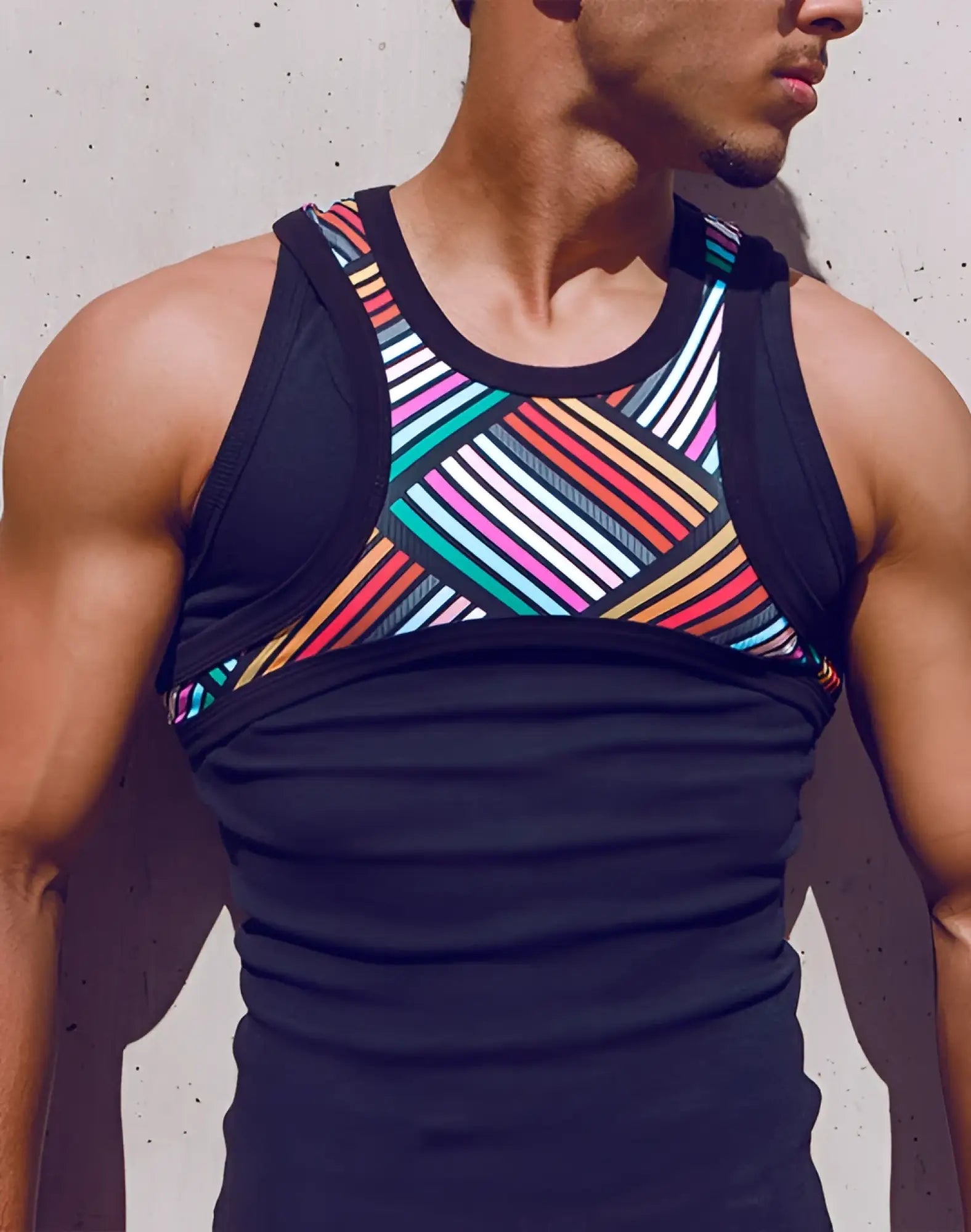 SupaWear ribbed singlet black athletic tank top with vibrant multicolored geometric diagonal stripes across chest