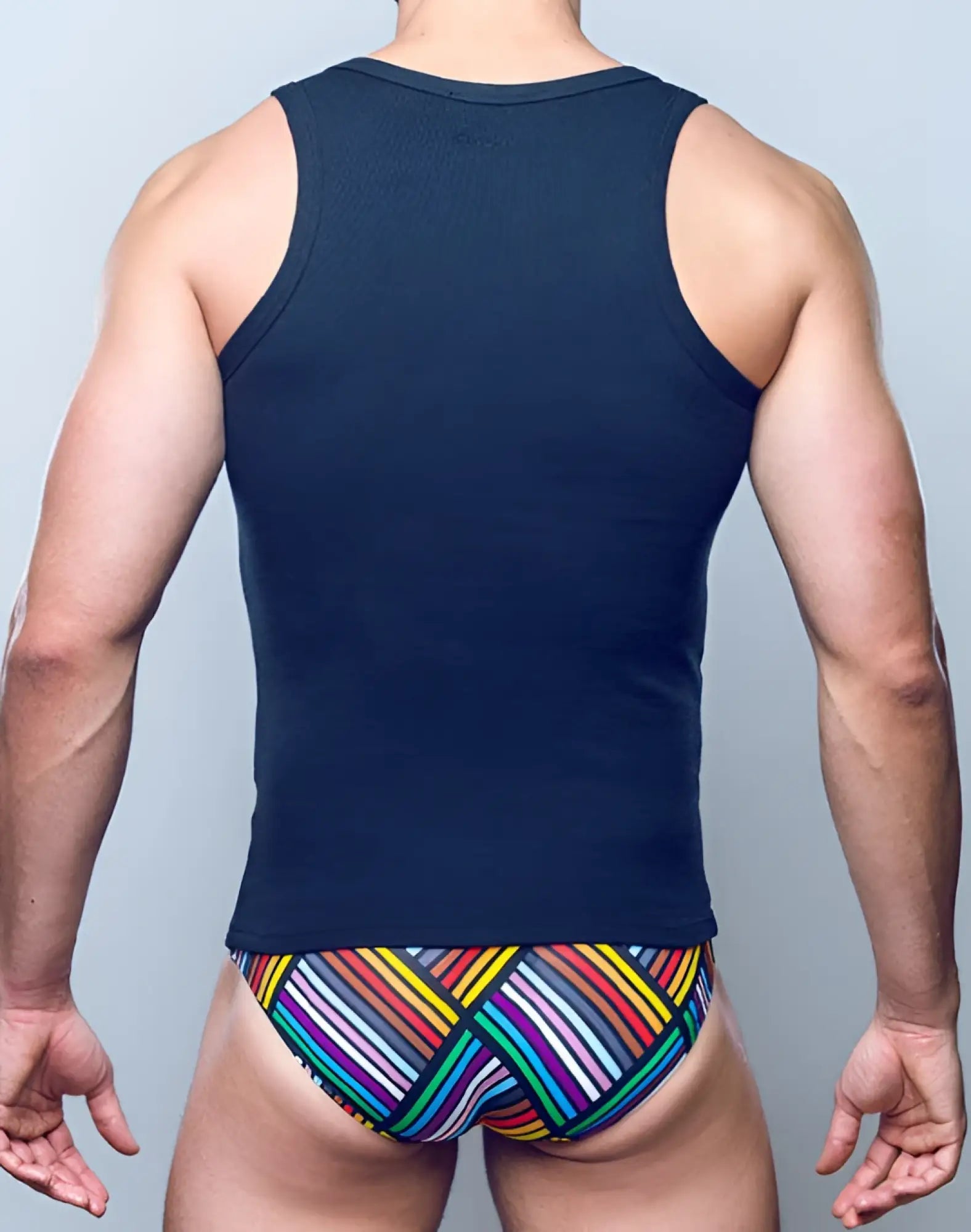 Navy blue ribbed SUPAWEAR singlet black paired with colorful geometric patterned briefs for casual wear