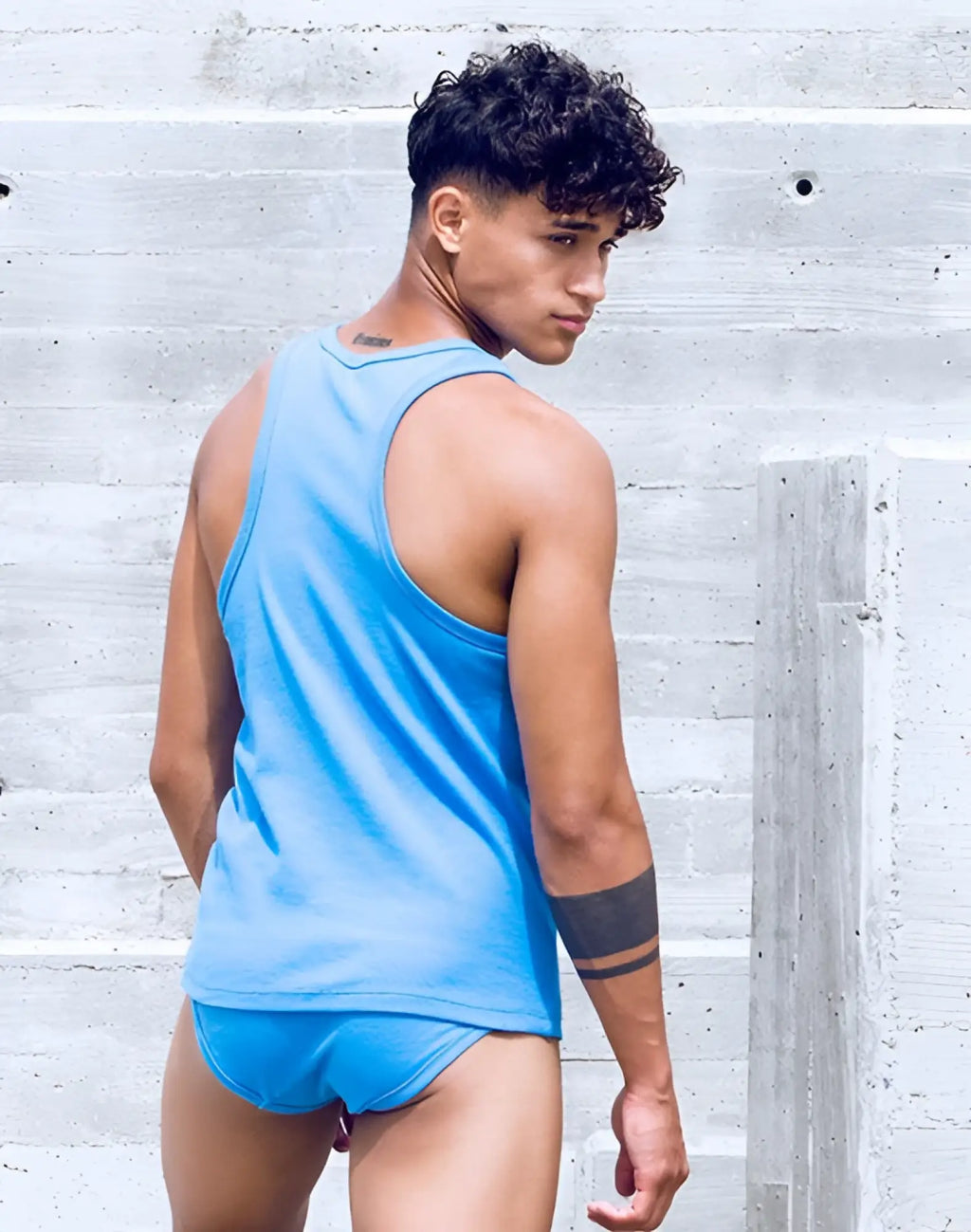 A vibrant blue SUPAWEAR ribbed sleeveless singlet with a simple round neckline and relaxed fit in marina color