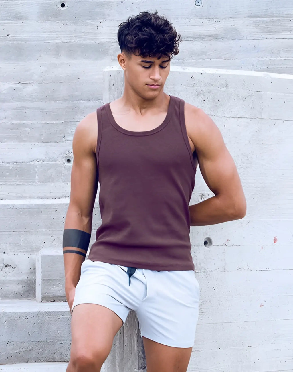 A fitted maroon cotton SUPAWEAR ribbed singlet with a round neckline and subtle ribbed trim on armholes