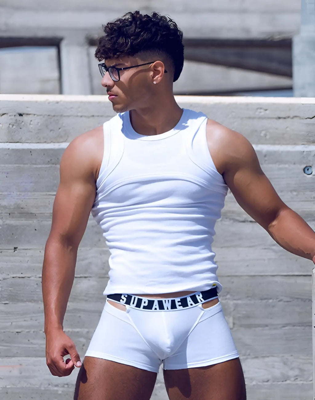 White supawear briefs with ribbed fabric and black waistband featuring white lettering for comfortable wear