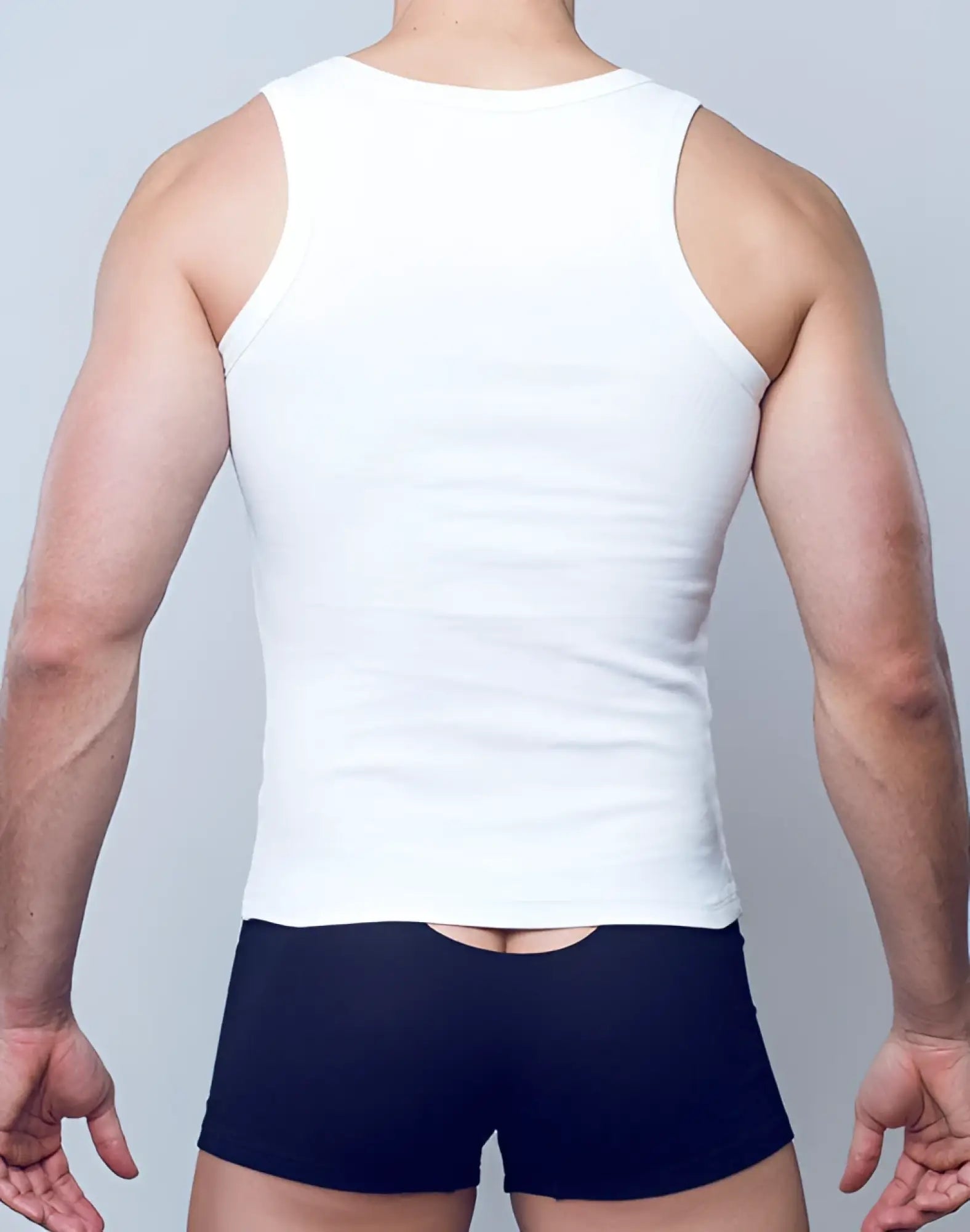 White ribbed SUPAWEAR singlet with a rounded neckline and shoulder straps in soft breathable fabric