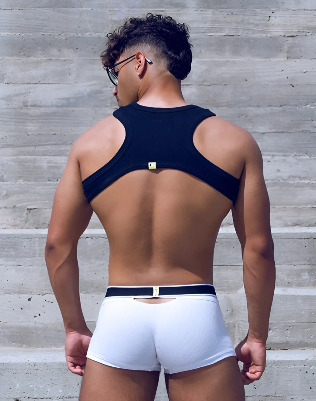 Black and white supawear ribbed slashed cropped top with sleek form-fitting athletic design showing front view