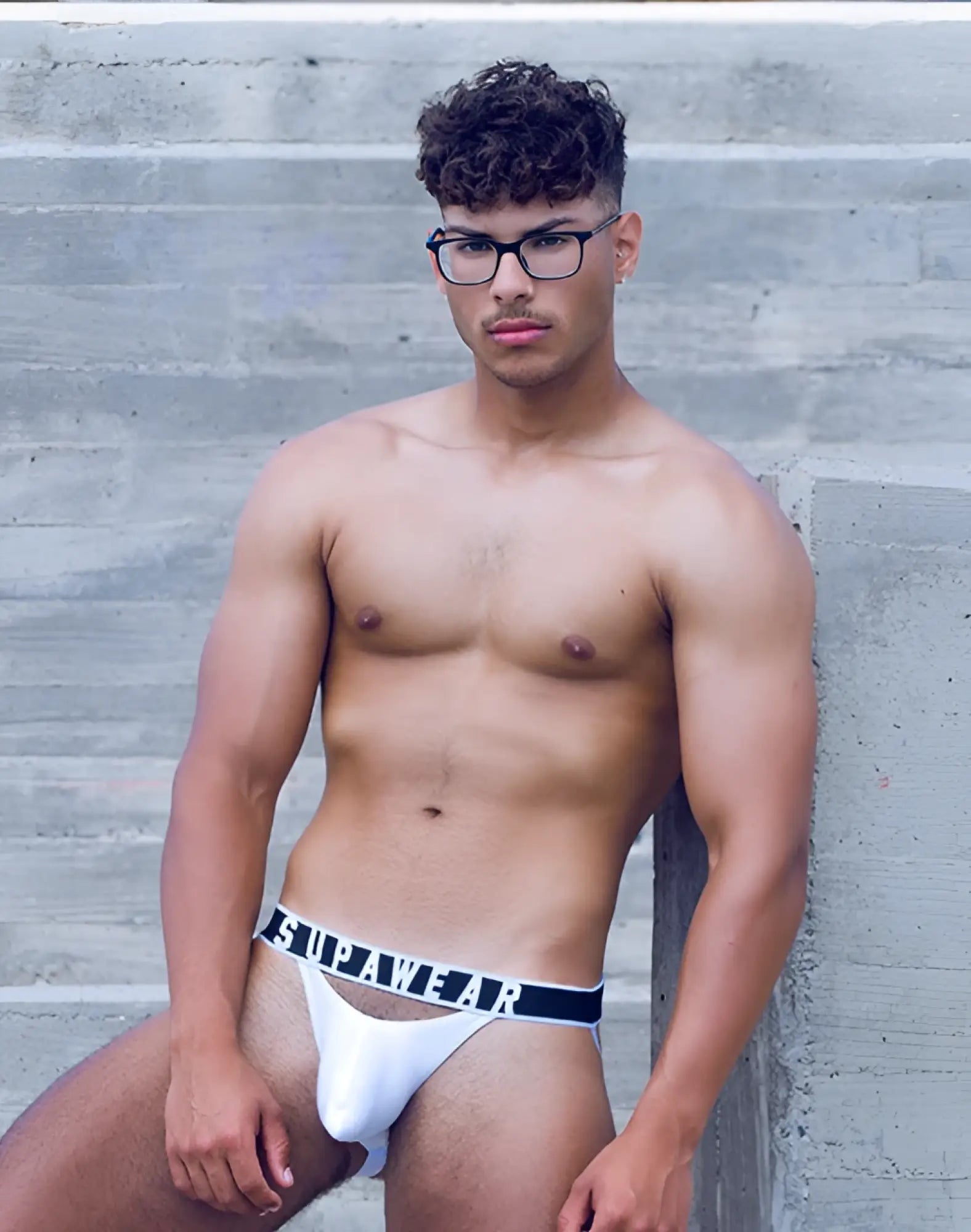 White supawear ribbed slashed jockstrap briefs with black elastic waistband featuring supawear branding