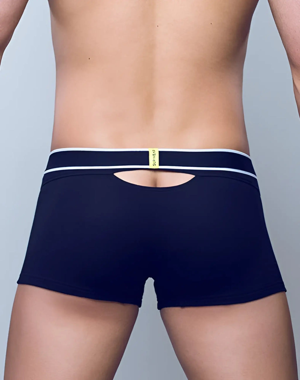 Back view of SUPAWEAR ribbed slashed trunk underwear in navy blue with white trim and central cutout detail