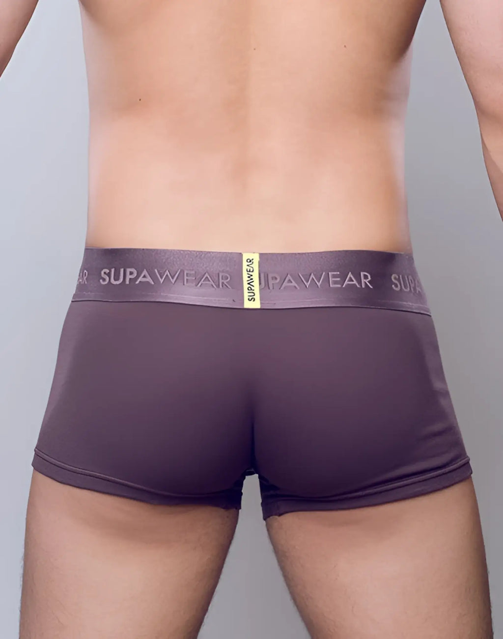 Purple supawear ribbed trunks underwear with gray logo waistband and small yellow tag in peppercorn color