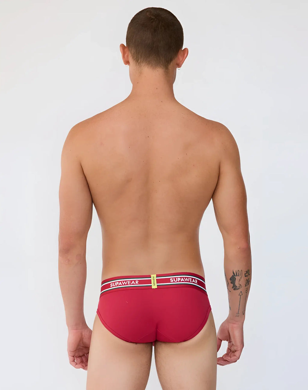 Red supawear ribbed varsity briefs with a white and black striped waistband featuring bold supawear branding