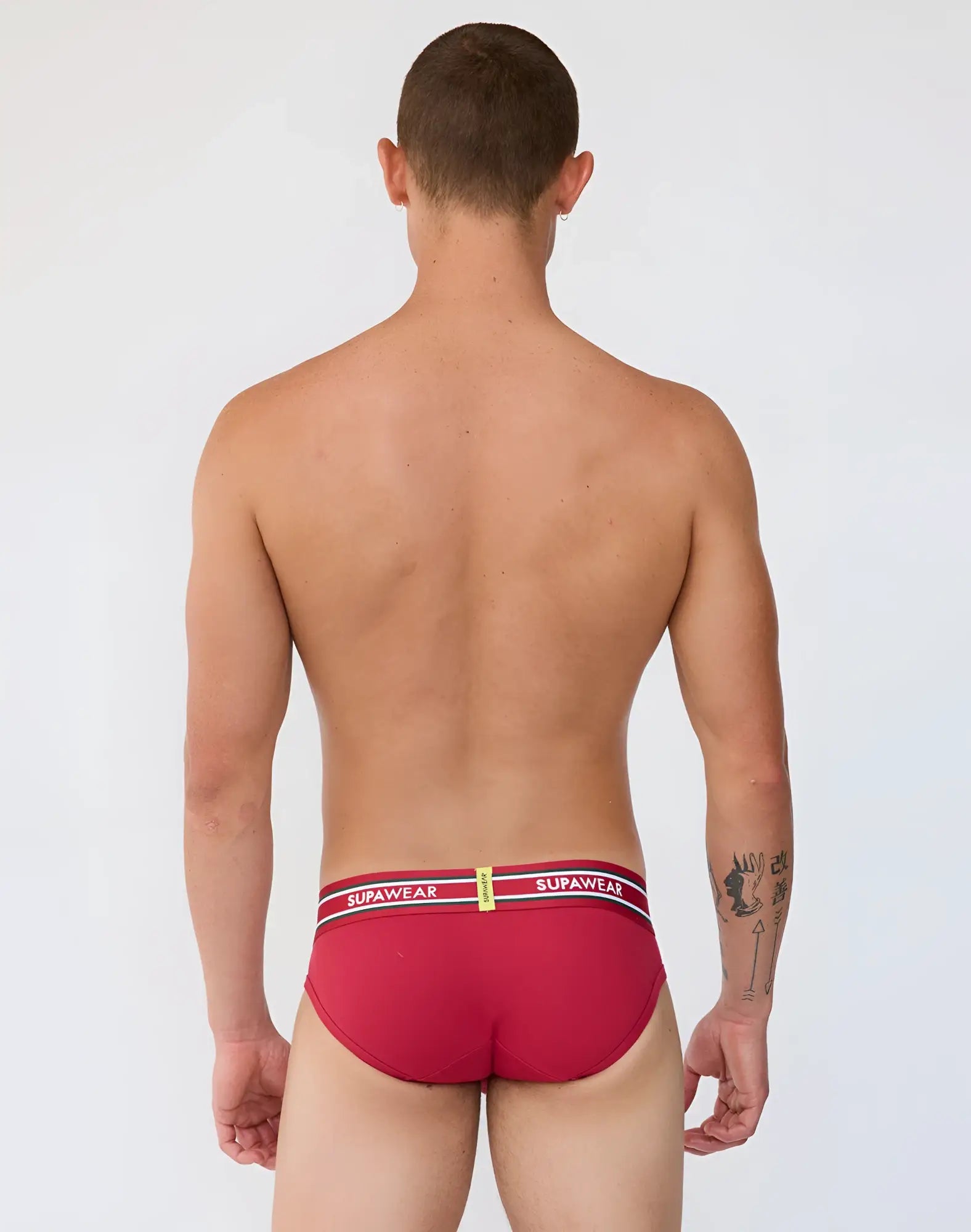 Red supawear ribbed varsity briefs with a white and black striped waistband featuring bold supawear branding