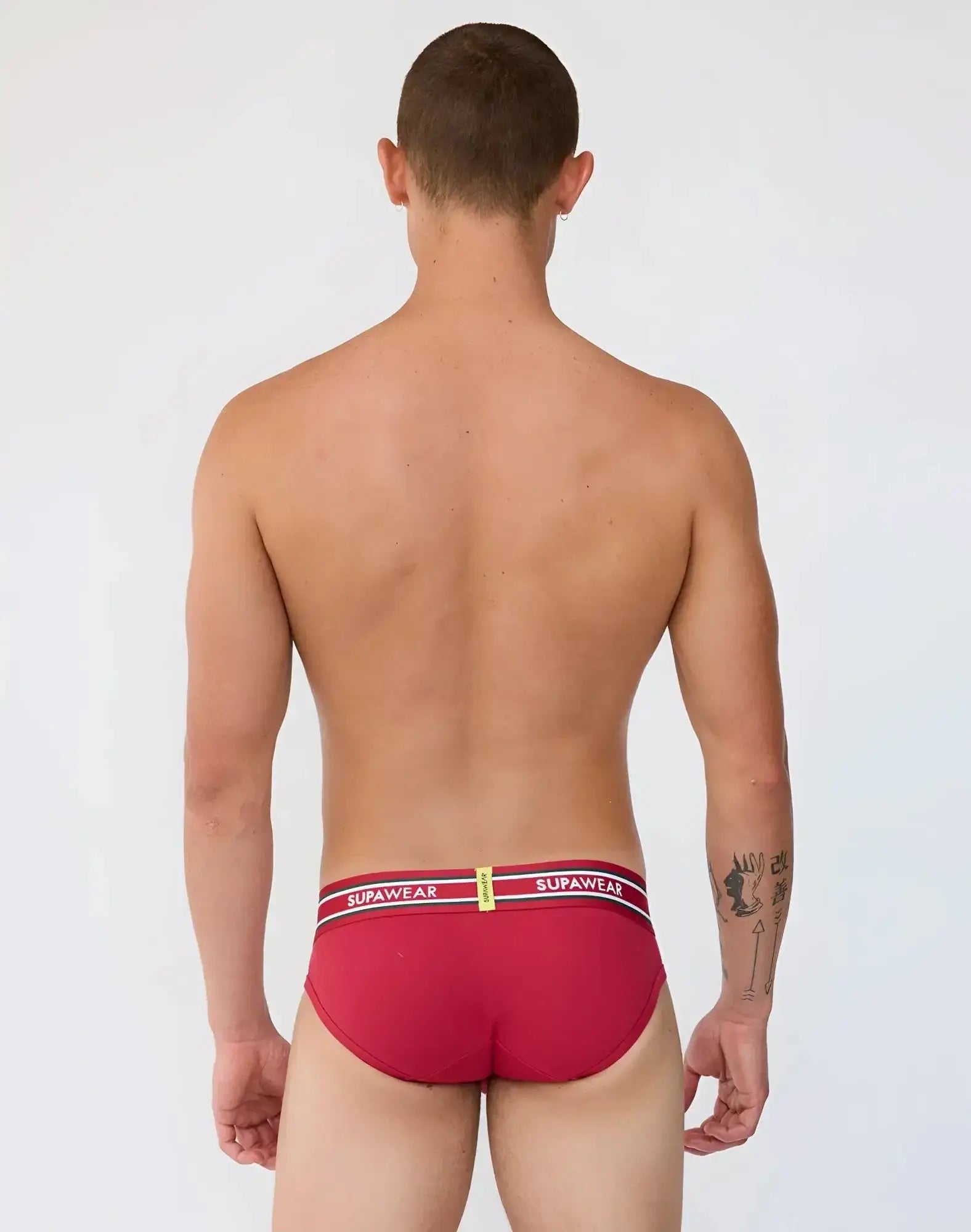 Red supawear ribbed varsity briefs with a white and black striped waistband featuring bold supawear branding