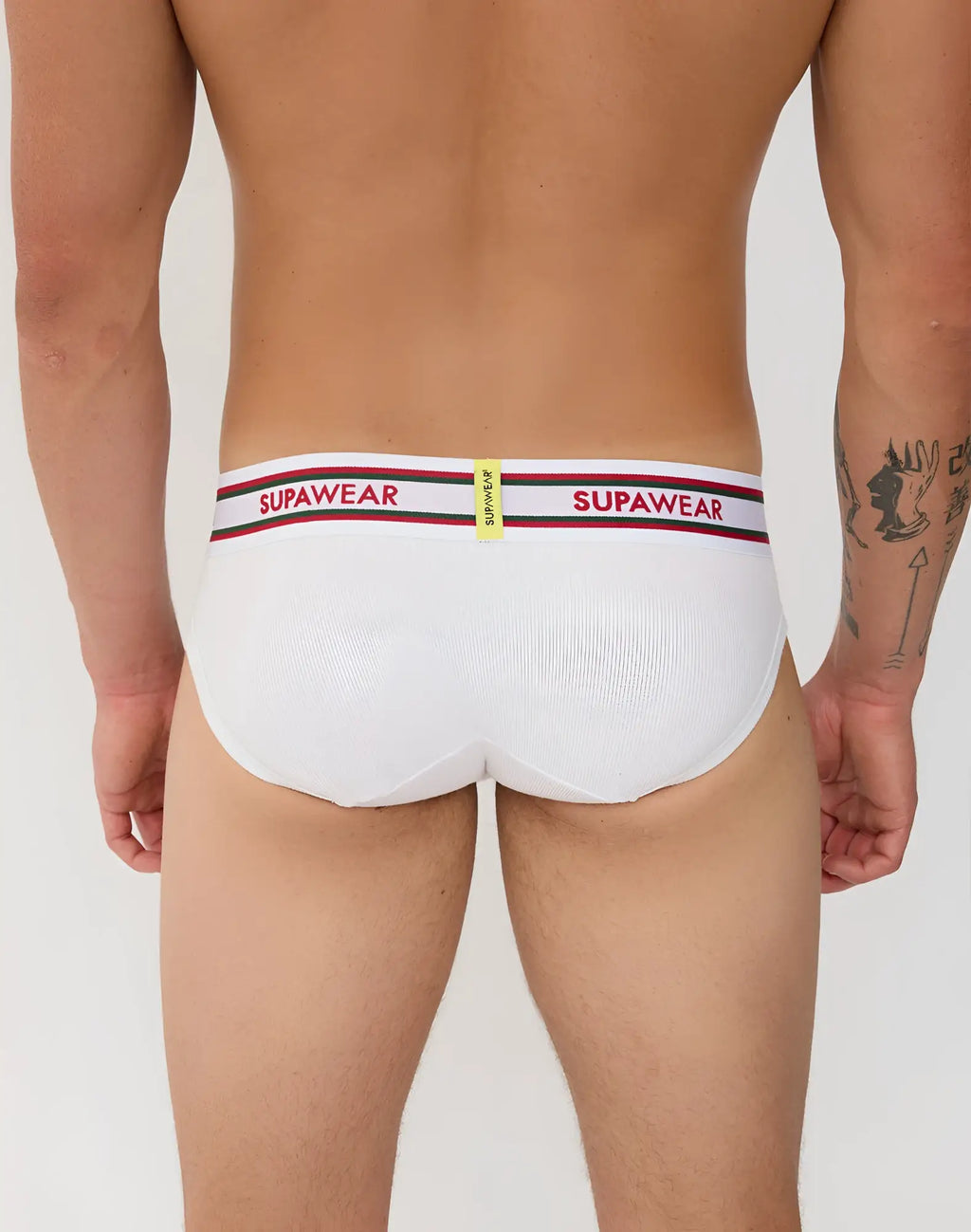 White supawear ribbed varsity briefs with a red and black striped waistband featuring bold brand lettering