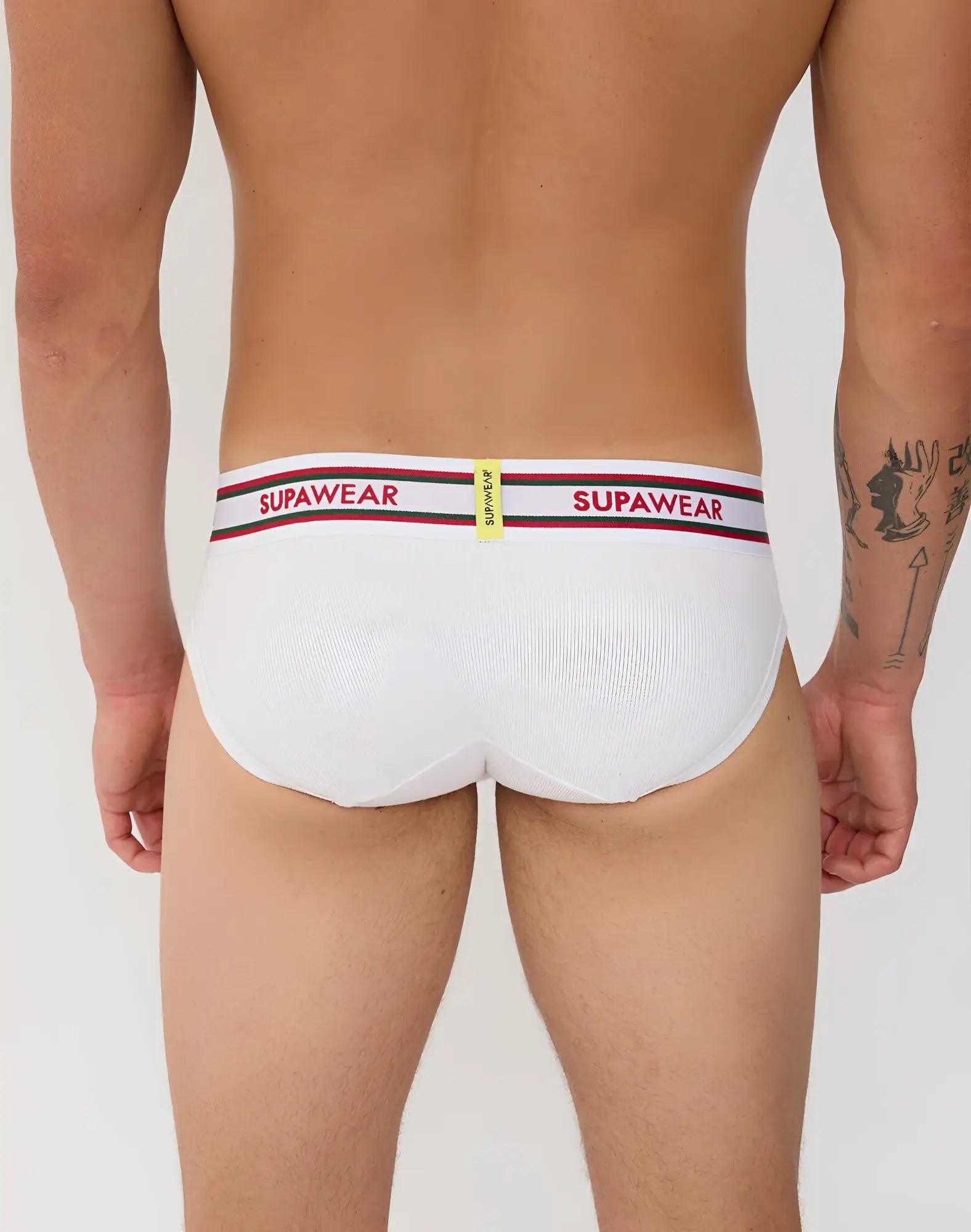 White supawear ribbed varsity briefs with a red and black striped waistband featuring bold brand lettering