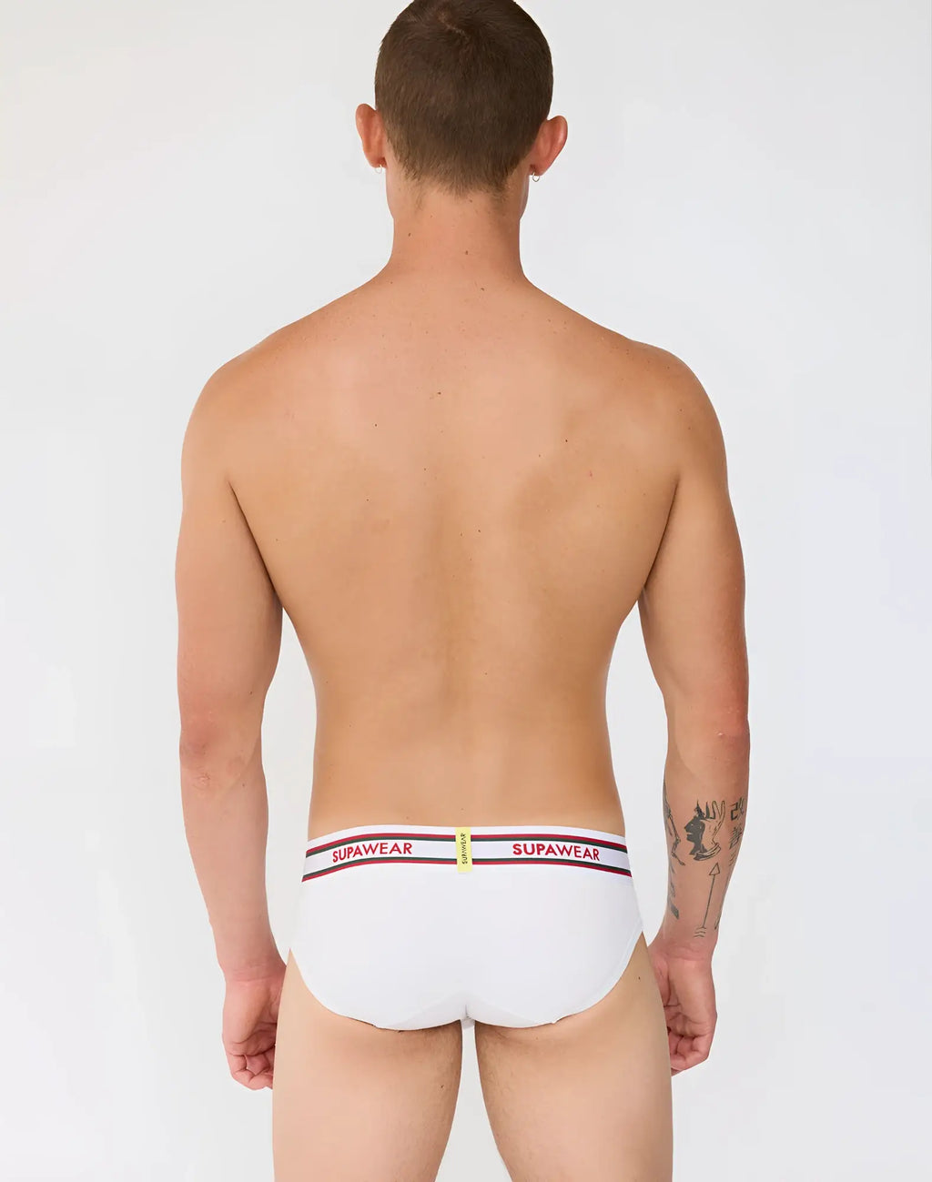 White supawear ribbed varsity briefs with a striped waistband featuring red and black supawear branding