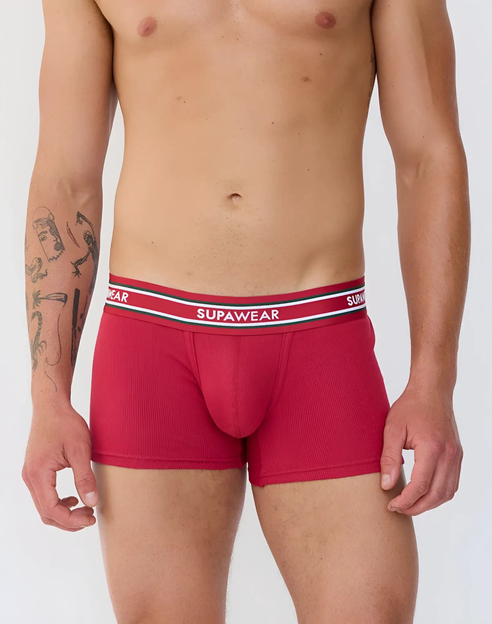 Red ribbed supawear boxer briefs with a white and black striped waistband designed for comfort and support