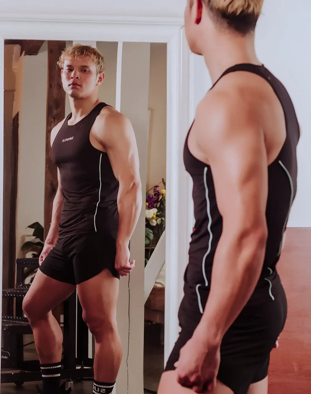 SupaWear semi-squared singlet black athletic tank top with white side piping and small chest logo for workout use