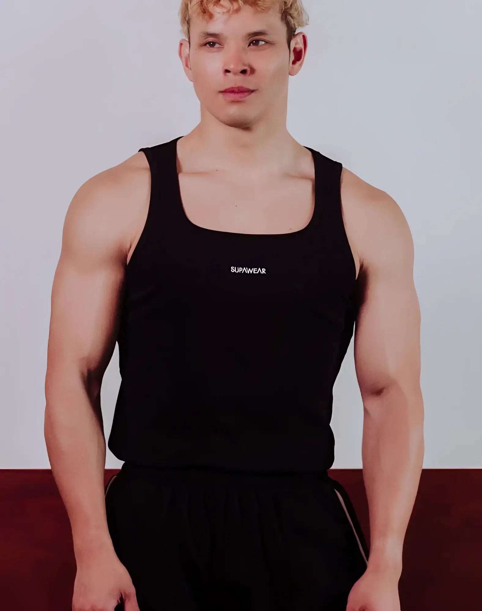 Black supawear semi-squared singlet tank top with square neckline and subtle white branding on the chest
