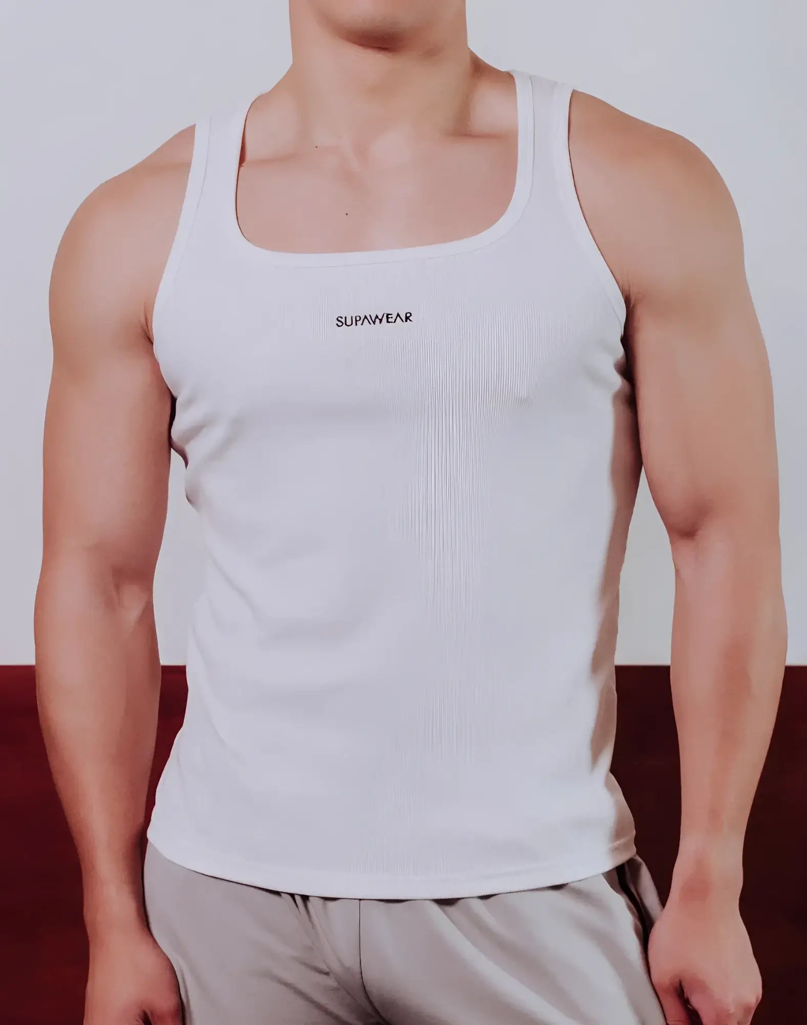 White ribbed cotton SUPAWEAR semi-squared singlet with embroidered logo across the chest