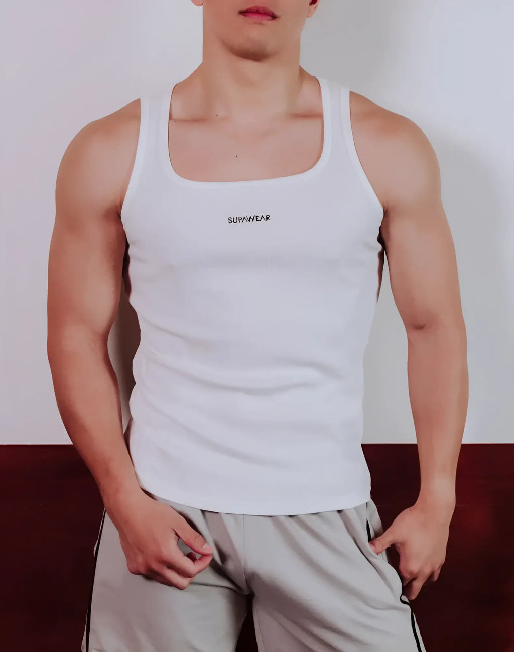 White supawear semi-squared singlet tank top with square neckline and subtle black branding on the chest